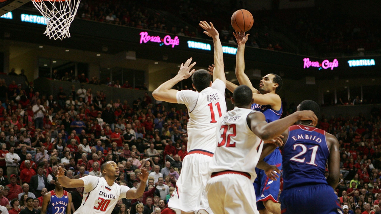 No. 8 Kansas hangs on to beat Texas Tech 64-63